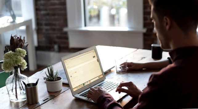 Man working on a laptop in an office