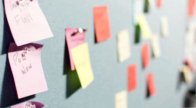 Sticky note reminders on board