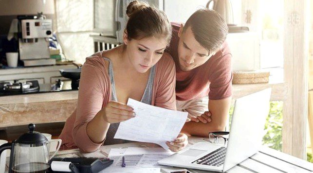 Couple looking at mortgage denial letter